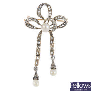 An early 20th century silver and gold pearl and diamond bow brooch.