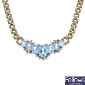A 9ct gold topaz and diamond necklace.