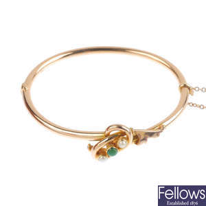 An Edwardian 15ct gold gem and split pearl bangle.
