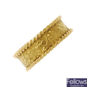 A 1970s 18ct gold textured band ring.