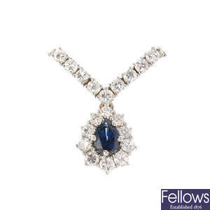 A sapphire and diamond cluster pendant, chain deficient.