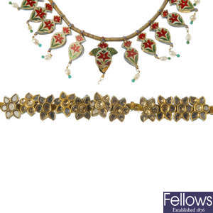 A wax filled enamel and gem-set necklace and bracelet.