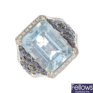 An aquamarine, sapphire and diamond dress ring.