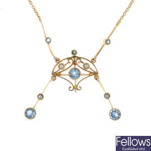 An Edwardian gold aquamarine and seed pearl necklace.