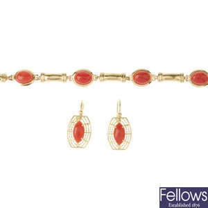 A coral bracelet and earrings.