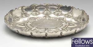 A late Victorian silver dish of shallow oval form.