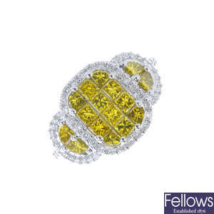 A colour treated 'yellow' diamond and diamond cluster ring.