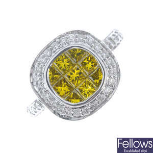 A colour treated 'yellow' diamond and diamond cluster ring.