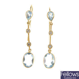 A pair of aquamarine and diamond drop earrings.