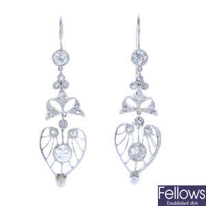 A pair of diamond and seed pearl earrings.