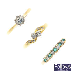 Three gold diamond and gem-set rings.