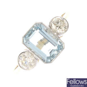 An aquamarine and diamond three-stone ring.