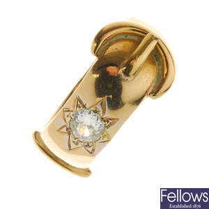 A late Victorian gold diamond buckle ring, circa 1890.