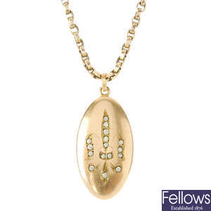 An early 20th century gold-plated paste fleur-de-lys locket, with 9ct gold chain.