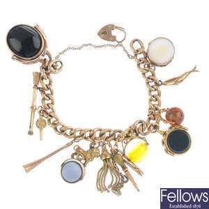 An early 20th century 9ct gold charm bracelet.