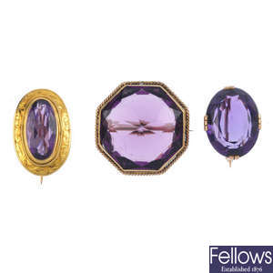 Three early 20th century and later amethyst and paste brooches.