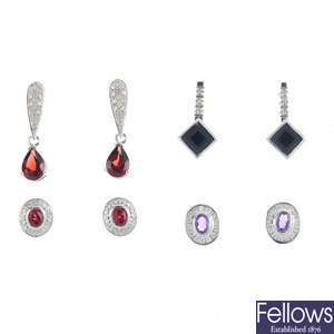 Seven pairs of diamond and gem-set earrings.