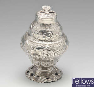An early George III silver tea caddy with chinoiseire decoration.