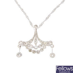 A diamond and seed pearl pendant.