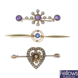 Three early 20th century 15ct gold gem-set brooches.