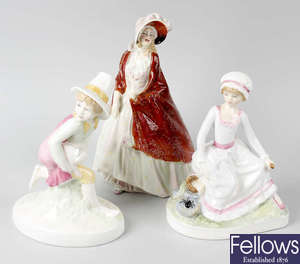 A group of five Royal Doulton figures.