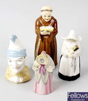A group of five Royal Worcester porcelain candle snuffers.