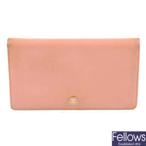 CHANEL - a pink bi-fold wallet.