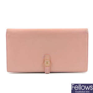 CHANEL - a pink leather wallet.