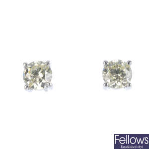 A pair of 18ct gold brilliant-cut diamond single-stone earrings.