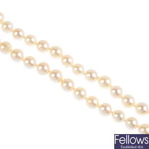 A cultured pearl single-strand necklace, with diamond and cultured pearl clasp.