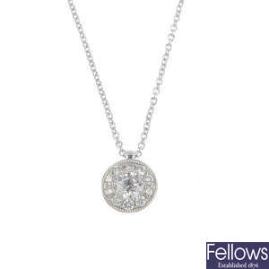 An 18ct gold diamond cluster pendant, on chain.