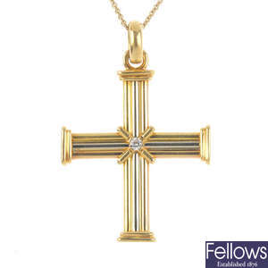 An 18ct gold cross, with chain.