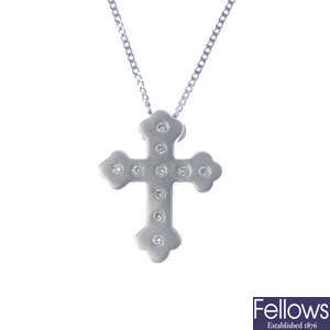An 18ct diamond cross pendant, with chain.