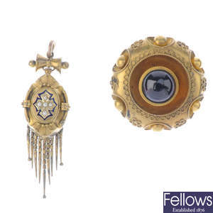 A late Victorian seed pearl and enamel pendant and a late Victorian garnet brooch.