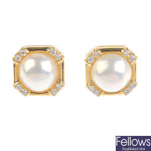 A pair of diamond and mabe pearl ear studs.