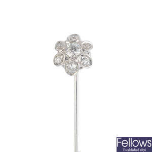 A diamond floral cluster stickpin.