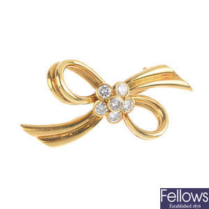 An 18ct gold diamond bow brooch.