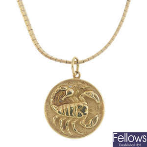 A 1970s 18ct gold zodiac pendant, with chain.