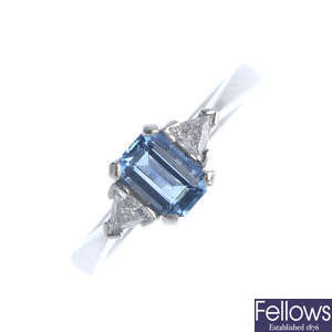 A platinum aquamarine and diamond three-stone ring.