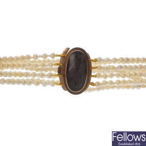 A mid Victorian seed pearl four-row bracelet, with gold mourning clasp.