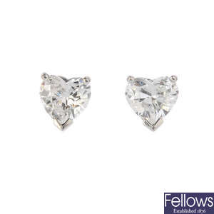 A pair of 18ct gold heart-shape diamond earrings.