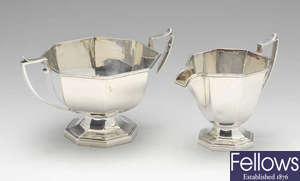 A 1920's silver cream jug and twin-handled sugar bowl.