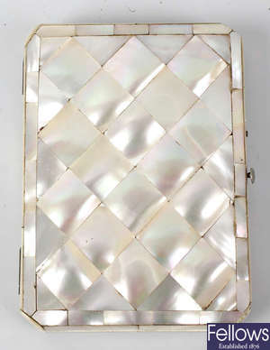 A single mother of pearl card case.