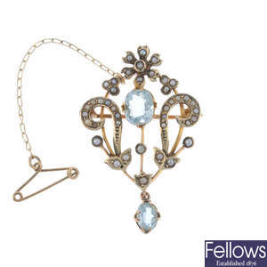 An early 20th century 9ct gold aquamarine and split pearl brooch and 15ct gold chain.