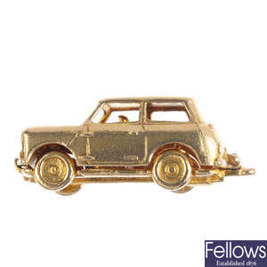 A 9ct gold car charm.