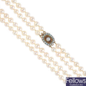 A double row cultured pearl necklace with late Victorian gold citrine and split pearl clasp. 