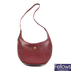 CARTIER - a Bordeaux leather hobo handbag.