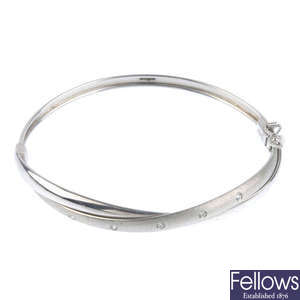A 9ct gold paste hinged bangle.