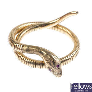 A 9ct gold snake bangle.