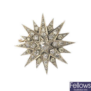 A diamond star brooch. 